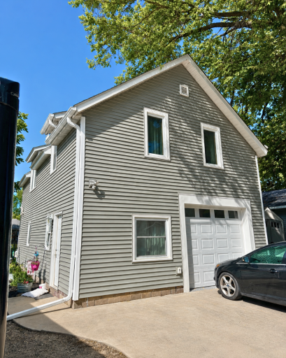 Attached one-stall garage plus additional off-street parking, with the garage door replaced in 2024.