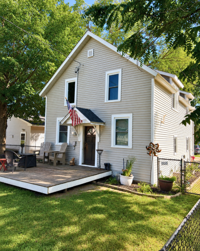The 16' x 12' composite deck creates a welcoming outdoor living space just outside the front door.