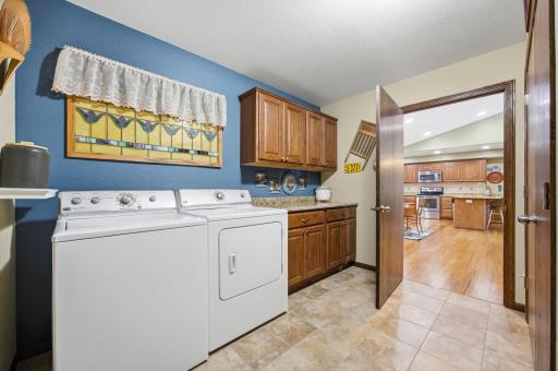 Laundry Room with Granite Counter & Tile Floor
