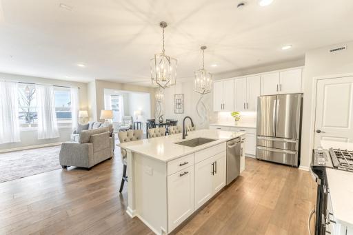 Welcome to this beautiful, south facing end-unit townhome.