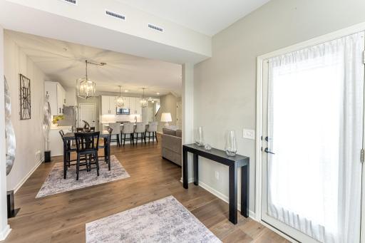 View looking from sunroom into main living area. Door on right leads to private patio.