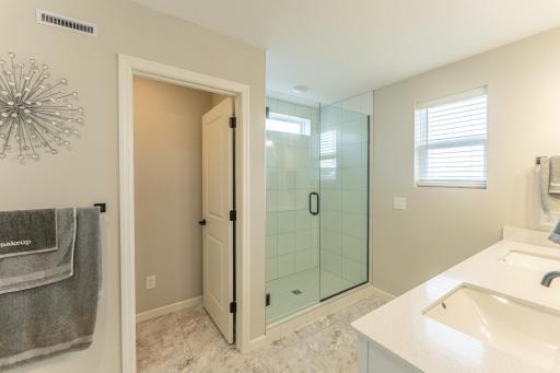 Another view of the primary bath with walk in shower.