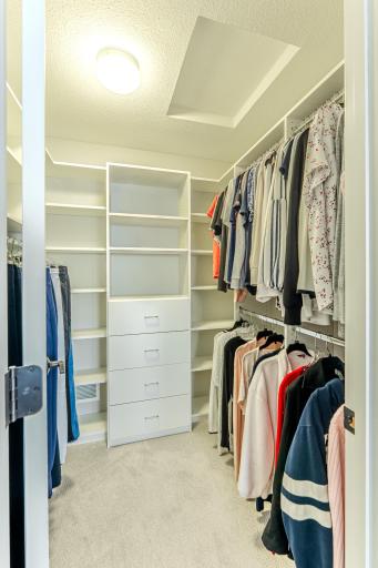 Primary walk in closet by Closets By Design.