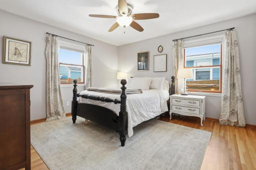 Three bedrooms are conveniently located on the main level, while the fourth bedroom is situated in the finished lower level, adding flexibility for guests, a home office, or hobby space.