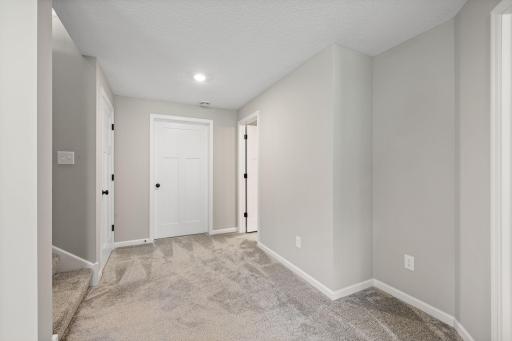 Large landing leads to additional storage space downstairs