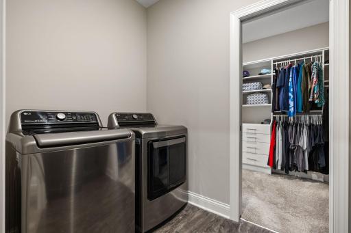 Walkthrough access to the main floor laundry room adds convenience