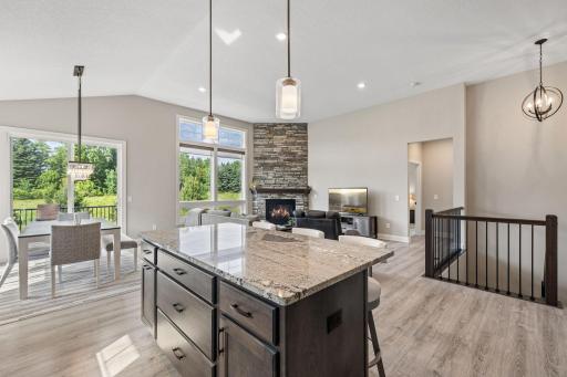 Gorgeous, bright open concept main living space with beautiful backyard views