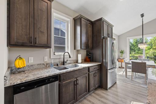 The kitchen leads to informal dining