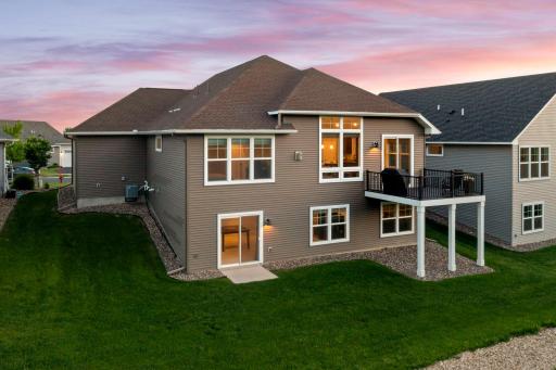 Enjoy this custom rambler with a walkout lower level and maintenance-free deck