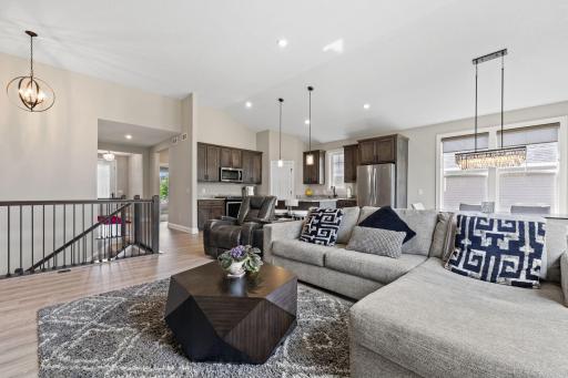 The kitchen and living room blend together beautifully, offering a functional and inviting space for entertaining