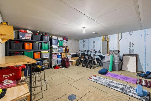 Unfinished utility room provides great additional space for storage, hobbies, or a workshop setup