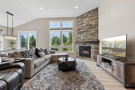 Soaring 12-foot ceilings and expansive energy-efficient windows fill the living room with beautiful natural light