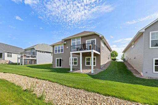 The back exterior is nicely landscaped and well maintained, with lawn care provided by the HOA