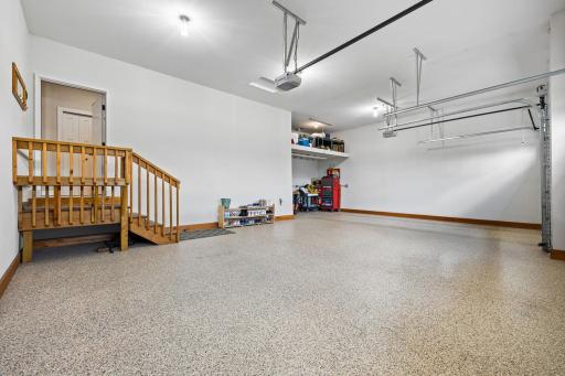 Enjoy the spacious oversized finished garage with commercial grade epoxy floors