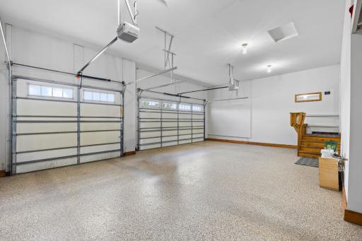 The finished custom garage is a standout bonus feature with abundant extra space for storage and use
