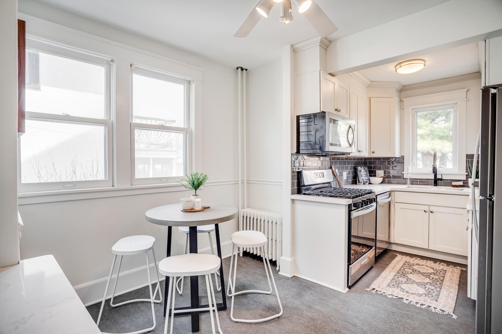 Recently updated kitchen with subway tile backsplash, quartz counters and stainless-steel appliances