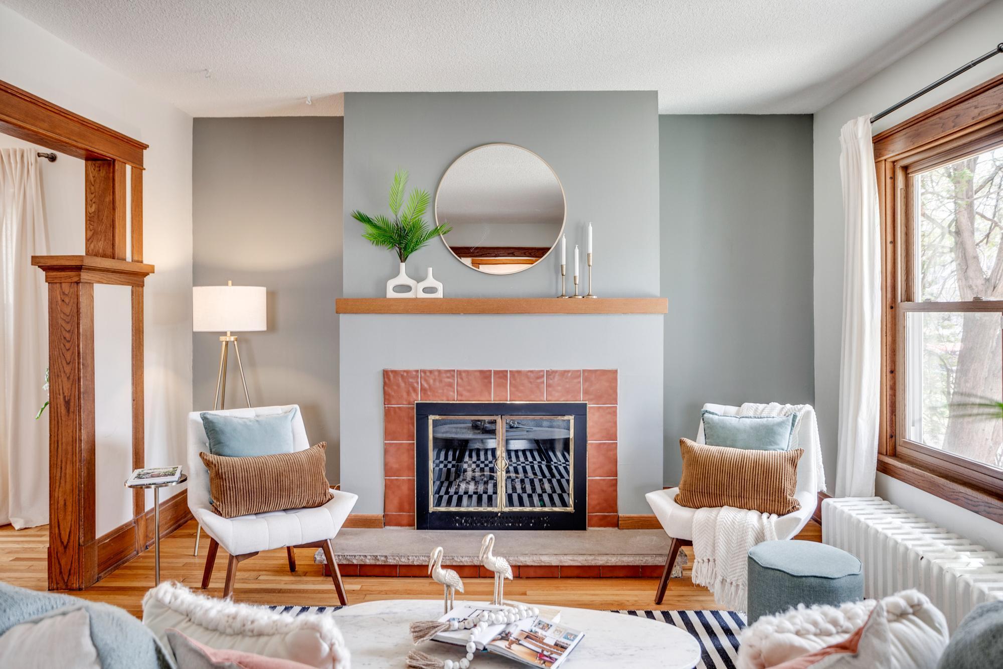 The main level features a large living room with a fireplace that flows into the formal dining room