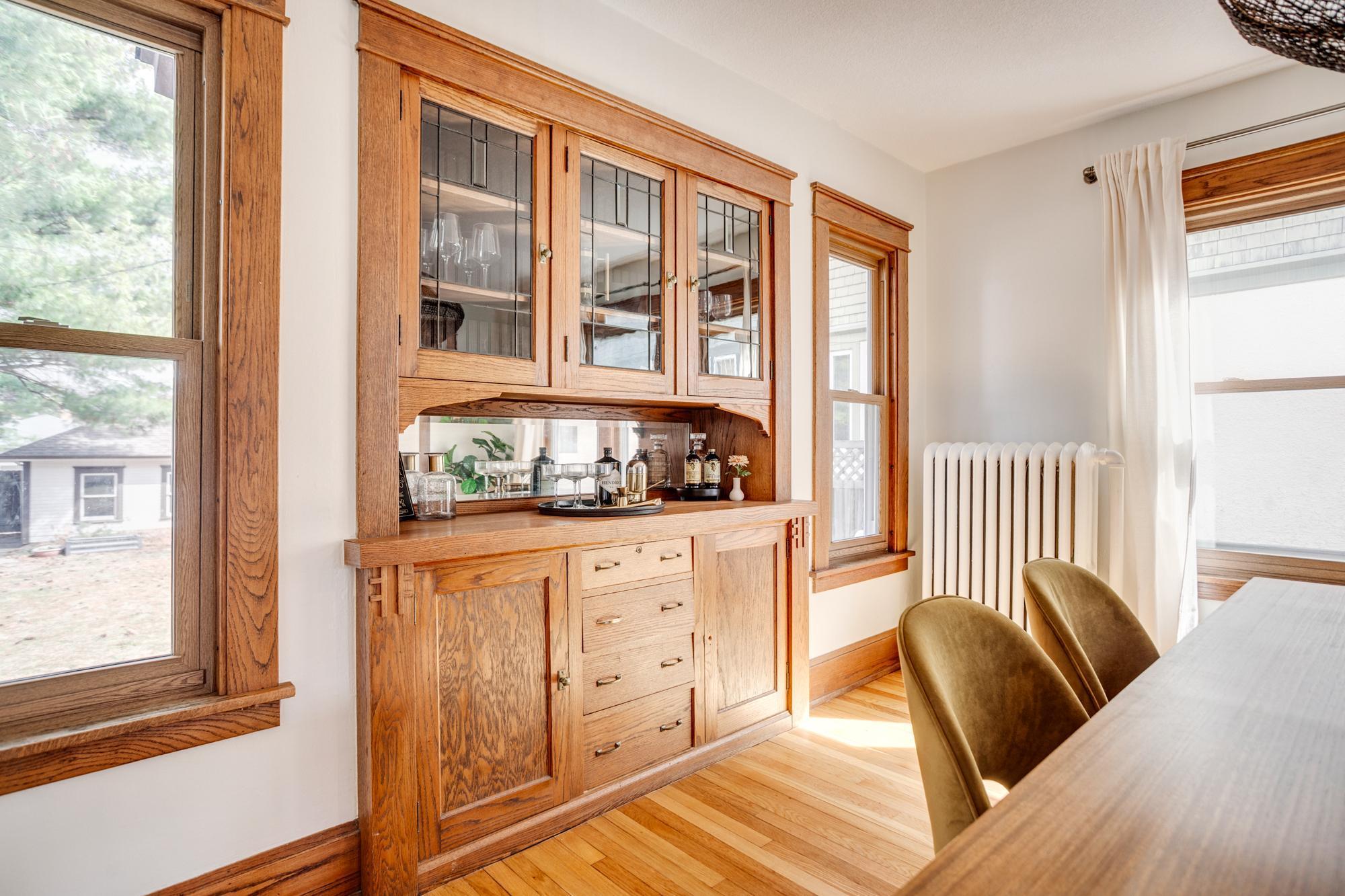 Formal dining room with original woodwork and built-ins
