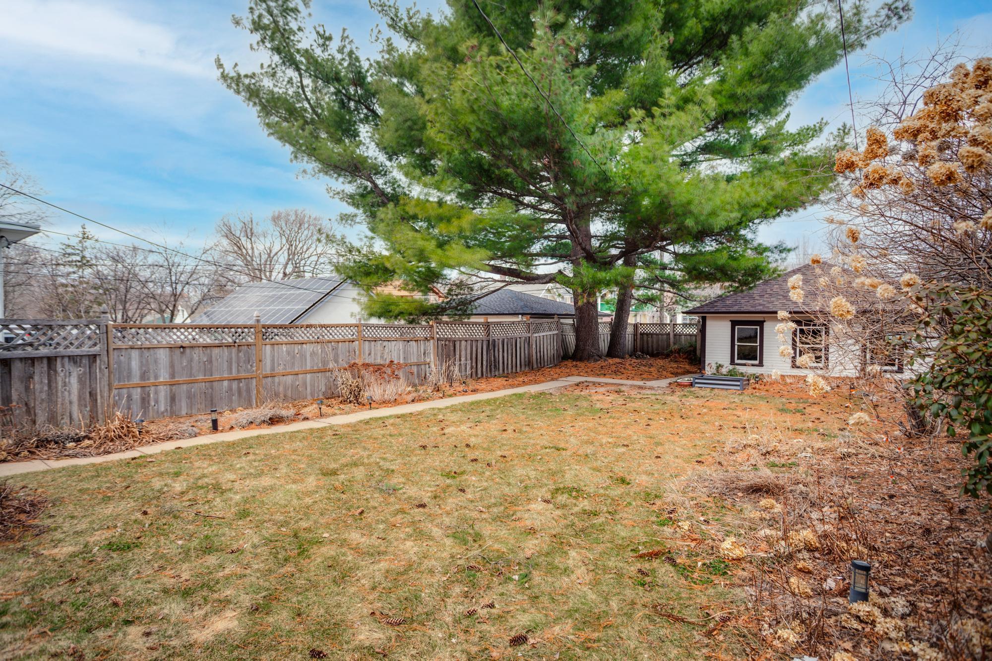 Private backyard to enjoy during the warmer months with newer perennial and wildflower gardens