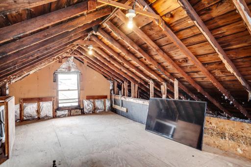 A third-level walk-up attic provides easily accessible storage or future expansion space