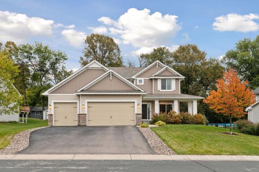 Great curb appeal with covered front porch and tree-lined yard