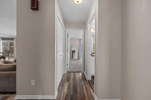Hallway leads to the primary bedroom & full bath