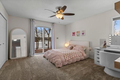 Main level bedroom 1 offers private deck access & double closets