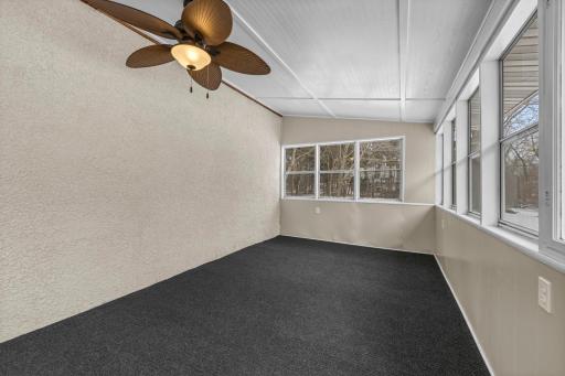 Enjoy additional living space in the 3 season porch off the detached garage