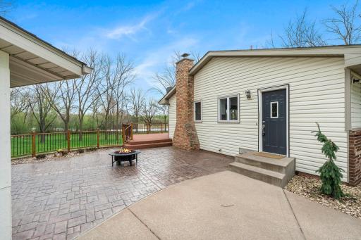 Enjoy the patio between the garage and the house with easy access to the back deck and sunroom