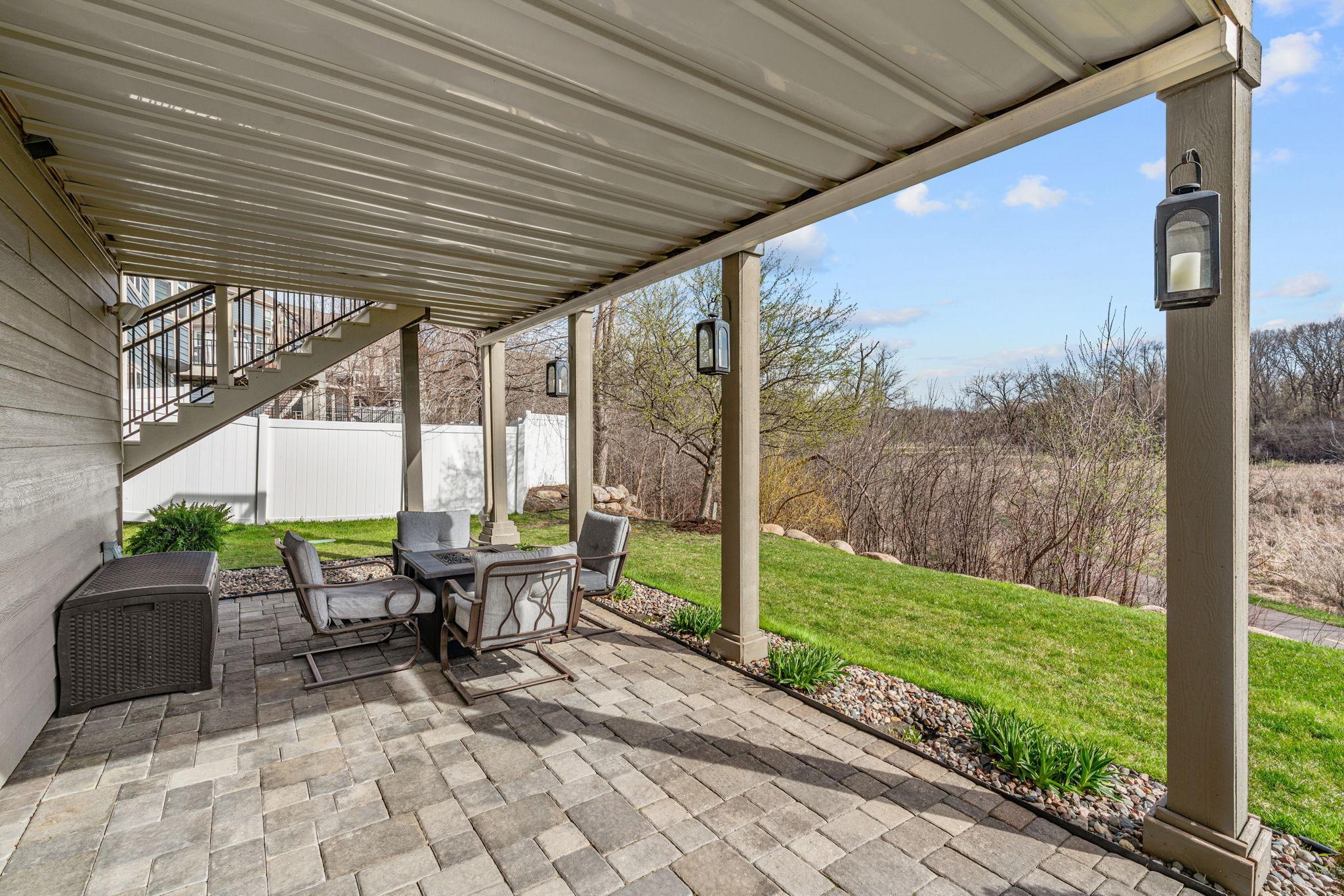 Walk out to Paver Patio with under-decking (for rain protection) overlooking wetland views.