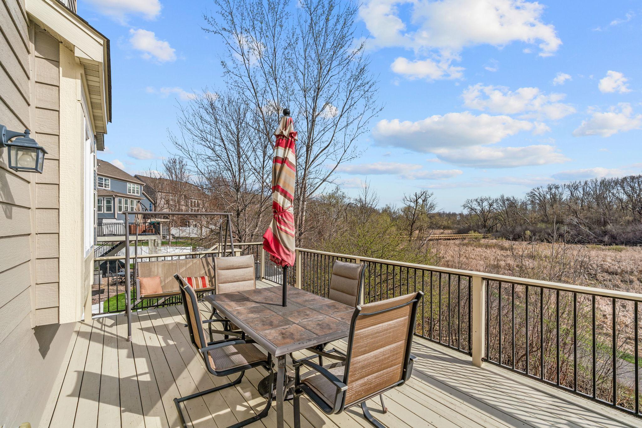 Overlooks private backyard with stunning wetland views & direct access to the Greenway