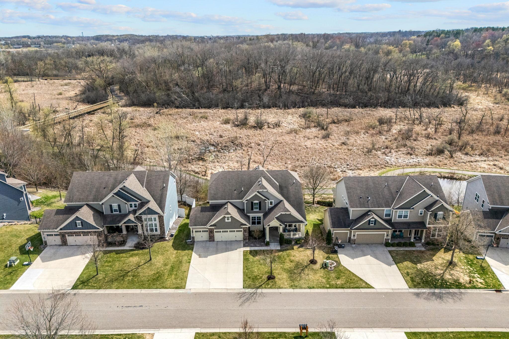 5000+ FSF on premium lot with stunning wetland views & direct access to the Greenway