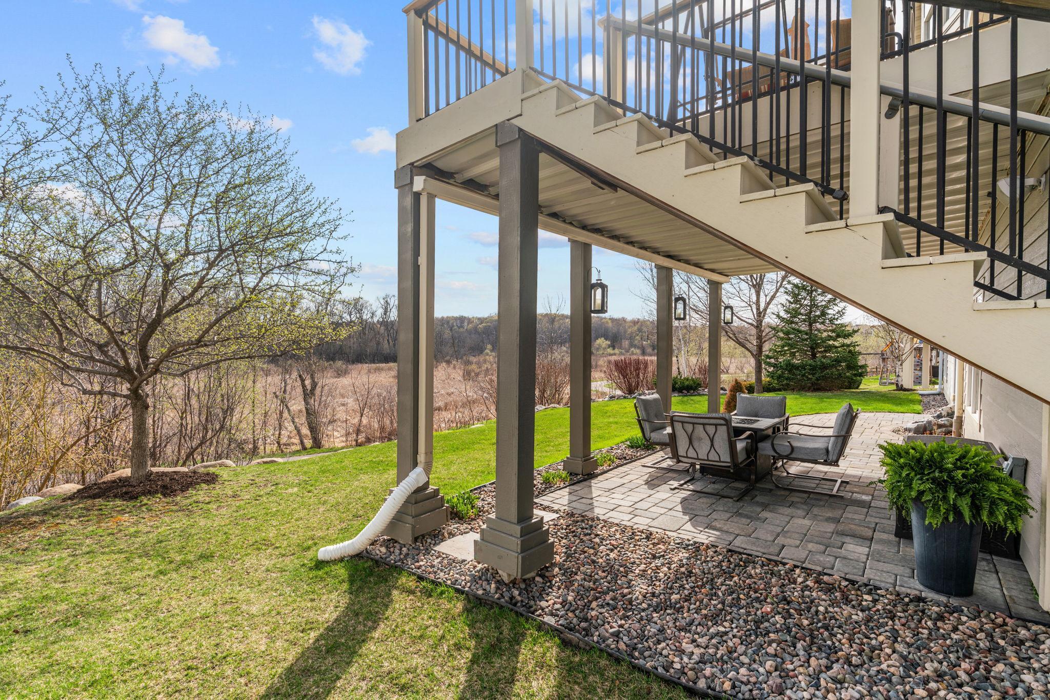 Walk out to Paver Patio with under-decking (for rain protection) overlooking wetland views.