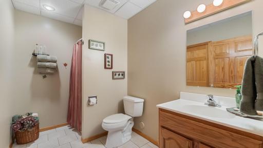 3/4 bathroom in the lower level right near the access to the lower level garage and the second bedroom.