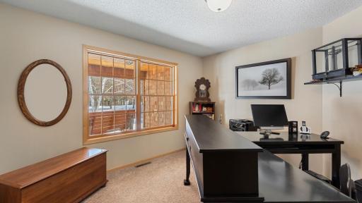Front office off of the foyer is accessible through french doors and overlooks the covered porch entry.