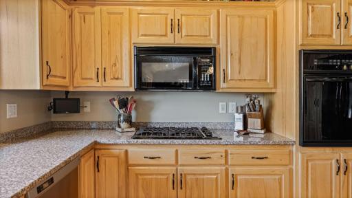 Enjoy your gas stove and mini TV screen as you cook. Everyone can appreciate a wall oven as well.