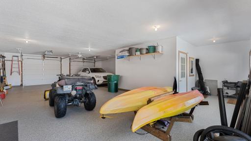 Upper level garage has poxied floor, fully finished walls and the enclosed access to the elevator with a ramp making the home fully accessible.