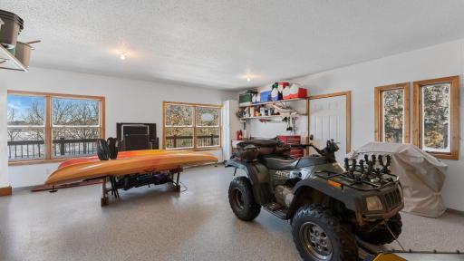 Clean and ready for use, this tandem double deep garage took advantage of the views and is also wrapped with the the decking. If you are going to live on the water, you might as well have a view from every space!