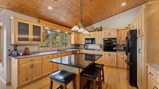 The kitchen impresses with great lighting and granite accents.