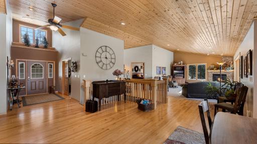High ceilings make a big impact. Canned lighting with fan accents are subtle addition. Gorgeous hardwood floors merge the rooms.