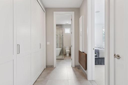 Upstairs Laundry room with fold-down folding table, cabinet ironing board
