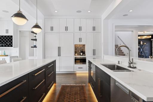 Built-in refrigerator and freezer. Coffee bar with filtered water service. Microwave, plus pantry storage