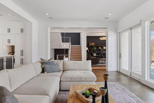 Sensational three story lighting is the stairwell creates beautiful ambiance on every floor