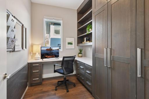 Main floor office with file drawers, roll out shelves and pantry storage