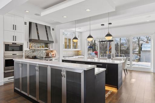 Two center islands provide plenty of space to create in this amazing Chef's kitchen