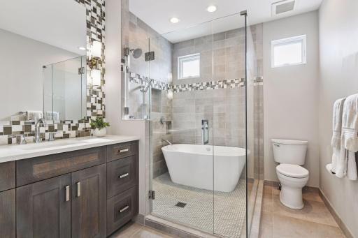 Upper full bath with shower room just steps from each bedroom