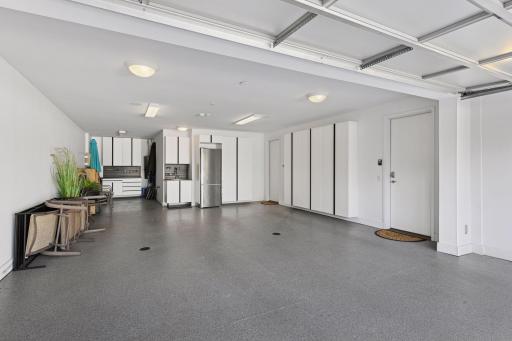 Unbelievable garage! Heated, epoxy floors, sink, refrigerator, water, built-in storage....WOW!