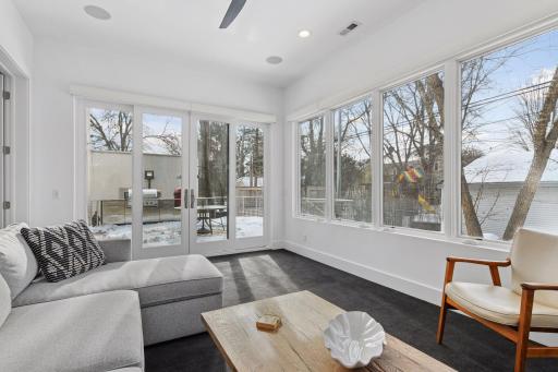 Transition from the Sun room or Informal Dining to the large deck and outdoor kitchen