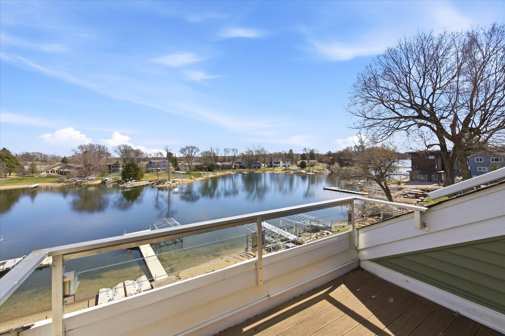 Serene sitting area within the primary suite overlooking the lake.