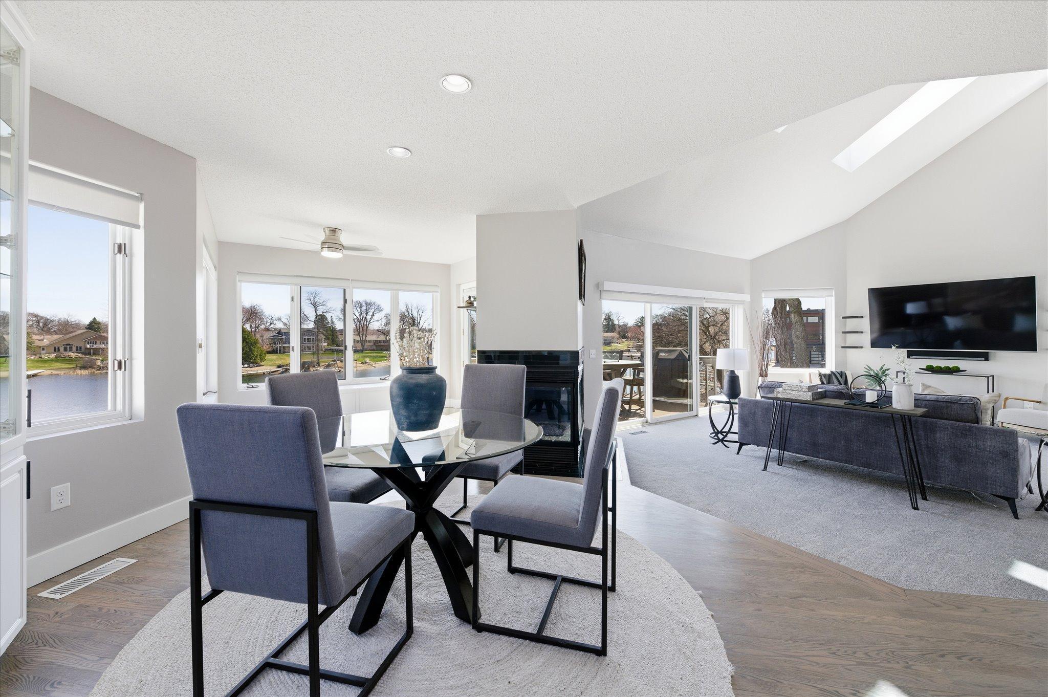 Dining area positioned to capture lake views with easy access to outdoor entertaining space.